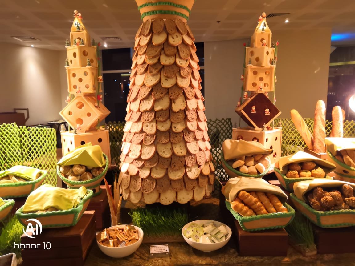 Large bakery display with a tall bread centerpiece