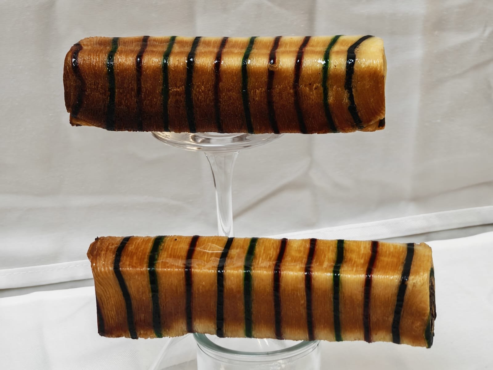 Striped cylindrical laminated bakery products